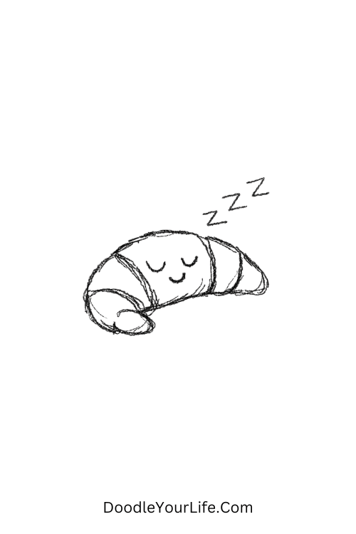 A doodle of a sleepy croissant curled up resting, food doodles for beginners