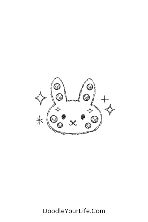 A doodle of rhinestone bunny face with sparkly gems, y2k doodles for beginners